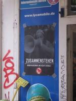 Foto 2: Plakat an einem Laden in Steilshoop