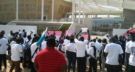 Youth holding postcards