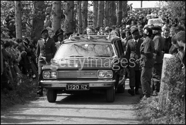 An IRA honour guard leads the funeral cortege of IRA hunger striker Francis Hughes in Bellaghy, in County Londonderry, 15th May 1981. (Photo by Alex Bowie/Getty Images) 