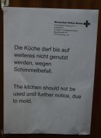 Warning sign on one kitchen door, been hanging for months