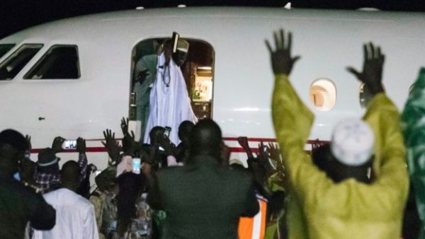 Jammeh waves to his supporters before flying out of Banjul
