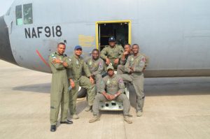 Nigeria Airforce officers pose for pictures before flying to Senegal